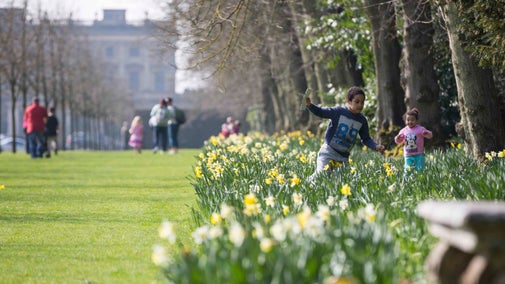 Children exploring the garden in springtime at Cliveden, Buckinghamshire